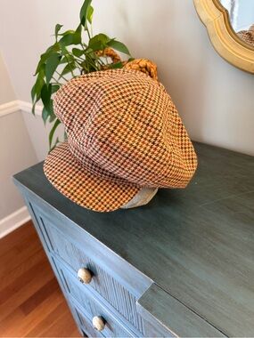 Baker Boy hat camel houndstooth Harris Tweed. 
Big poof hat